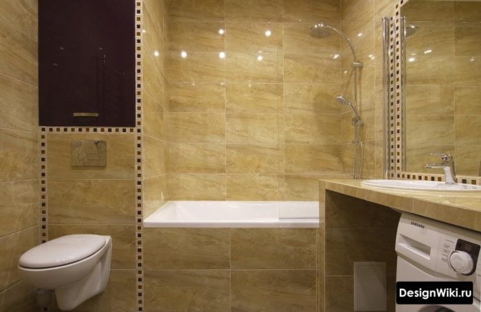 Монолитный дизайн ванной комнаты с туалетом и стиральной машиной